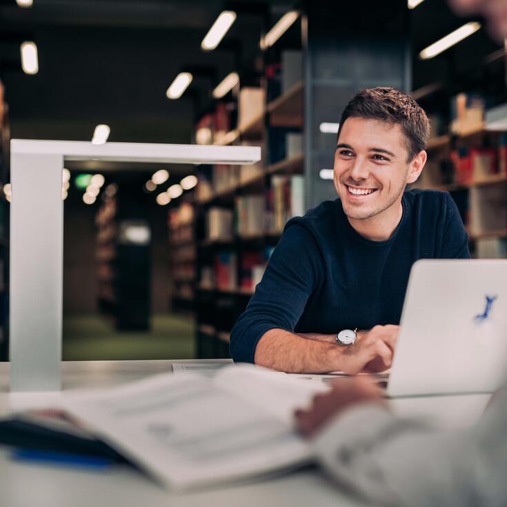 Student learns with a laptop