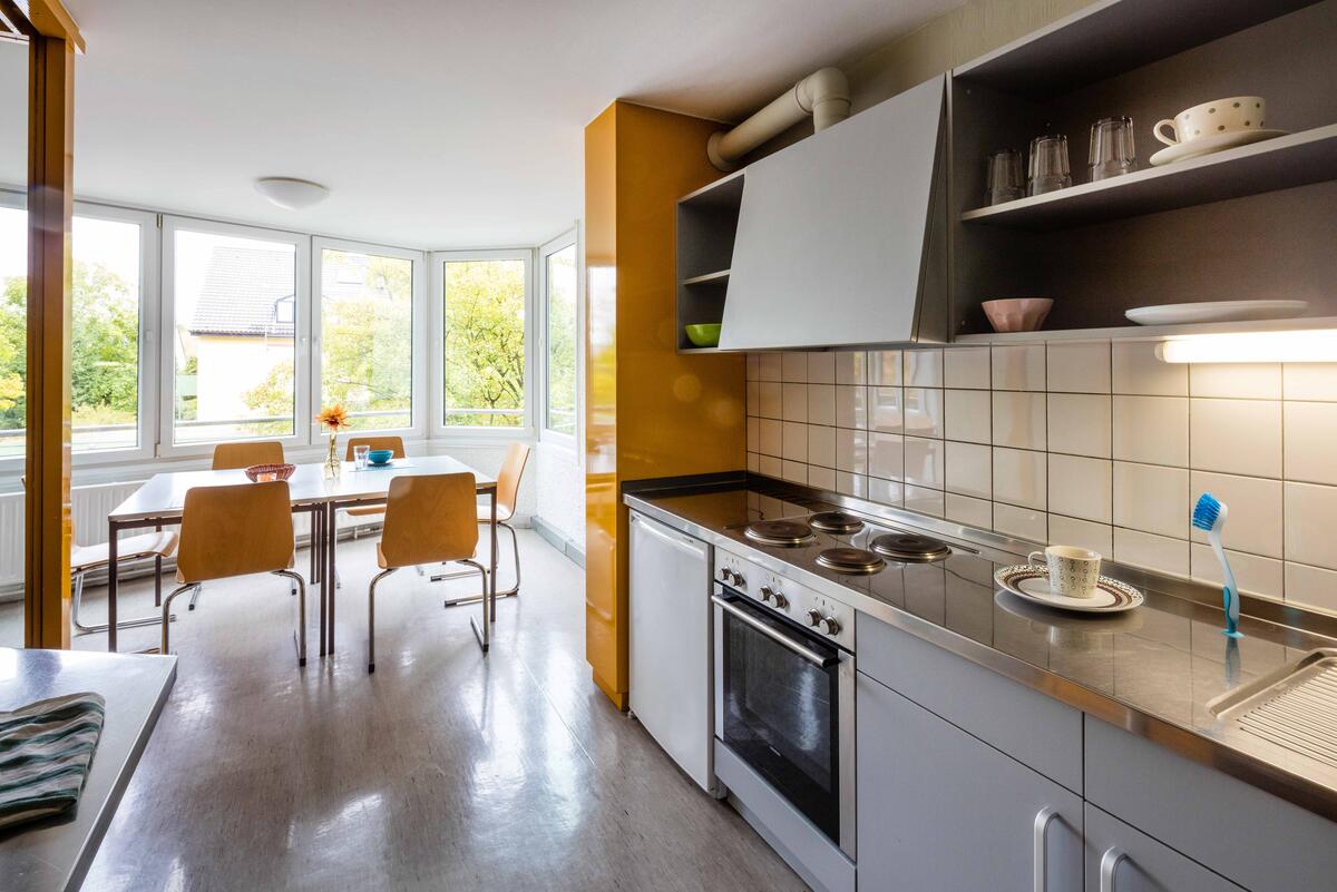 Kitchen with table and chairs in the dormitory of finance