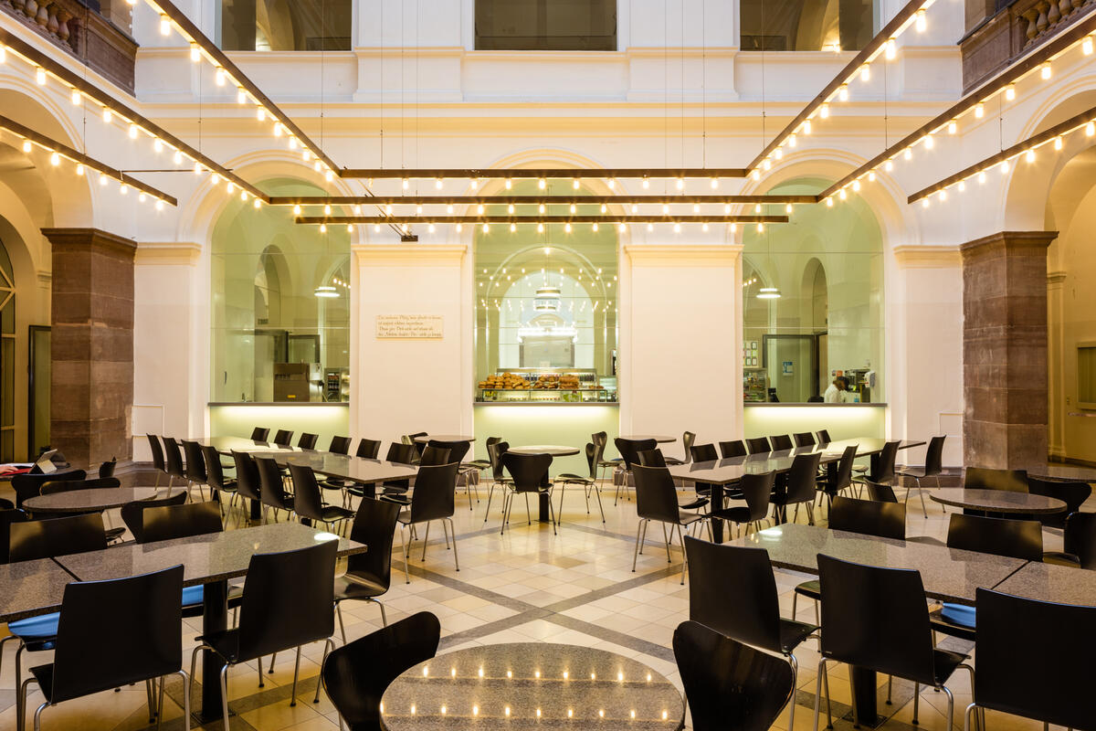 View of the hall with tables and chairs of the cafeteria HfT