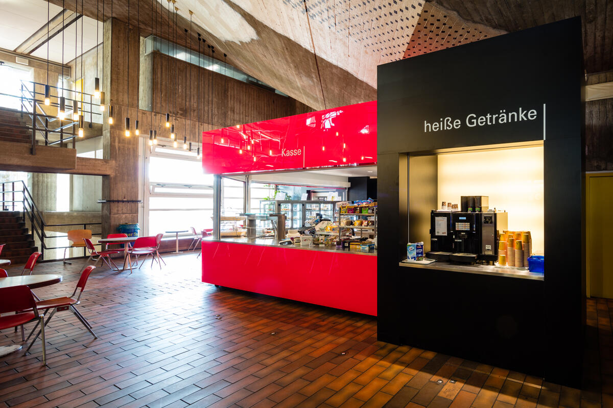 Side view of the coffee vending machine and the sales stand of the cafeteria Urknall