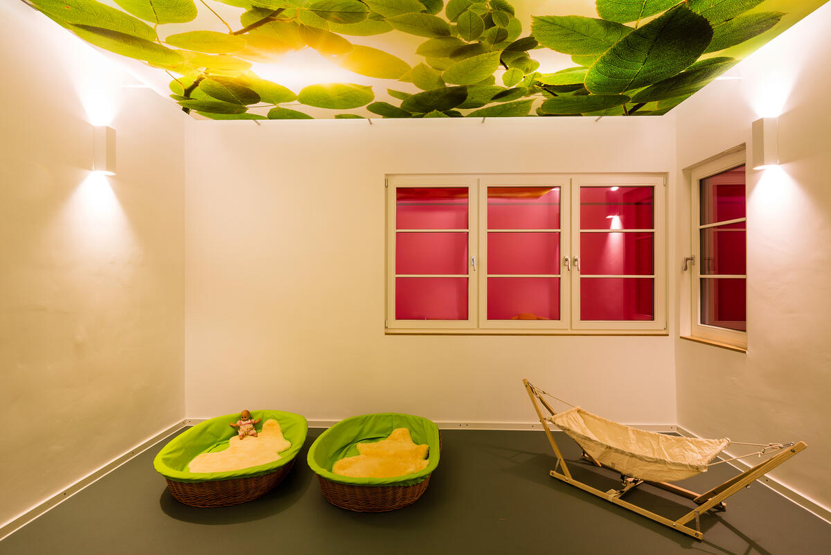 Bedroom of KiTa Villa MiO with beds and artificial light