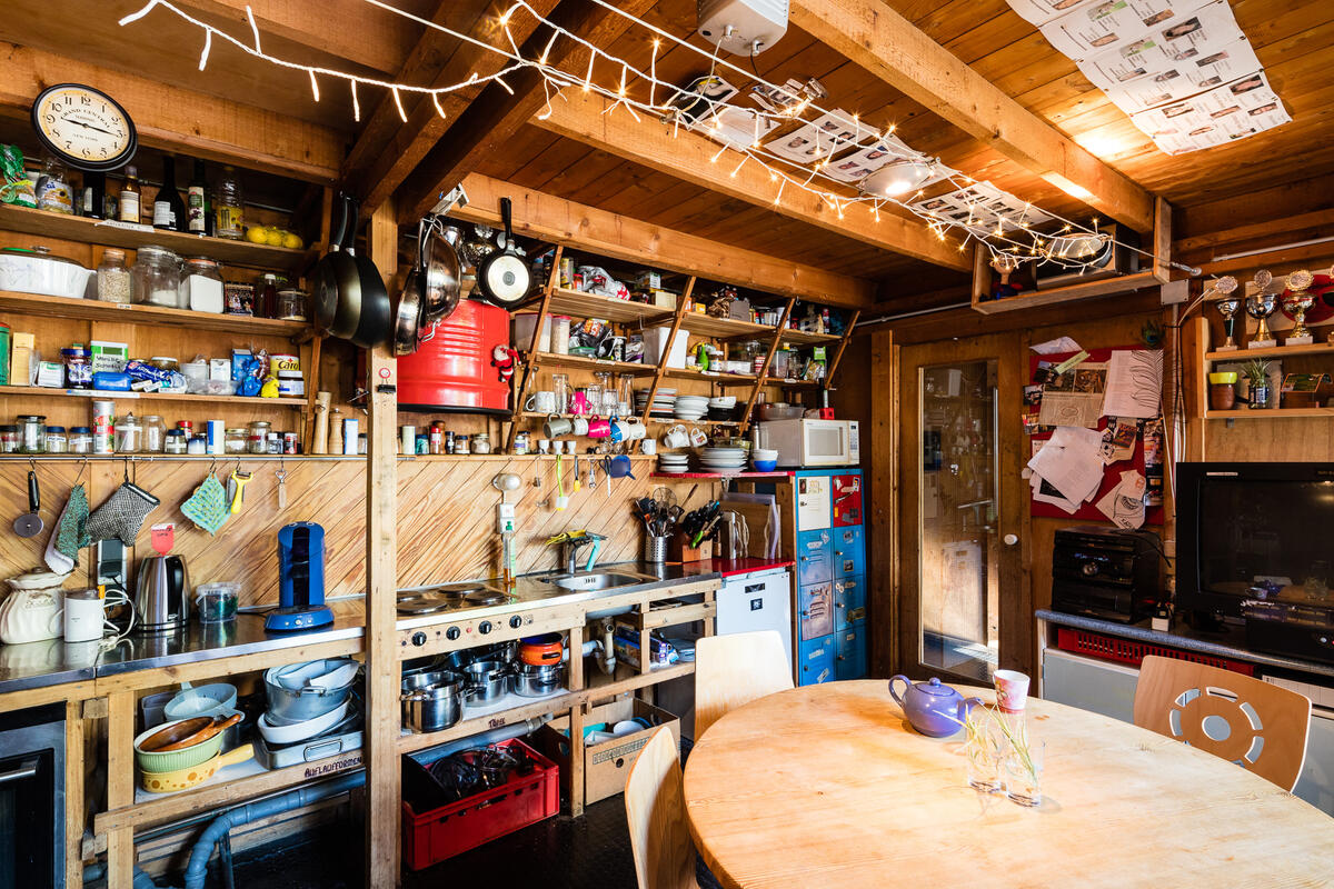 Kitchen with table, chairs and cutlery of the housing complex Bauhäusle