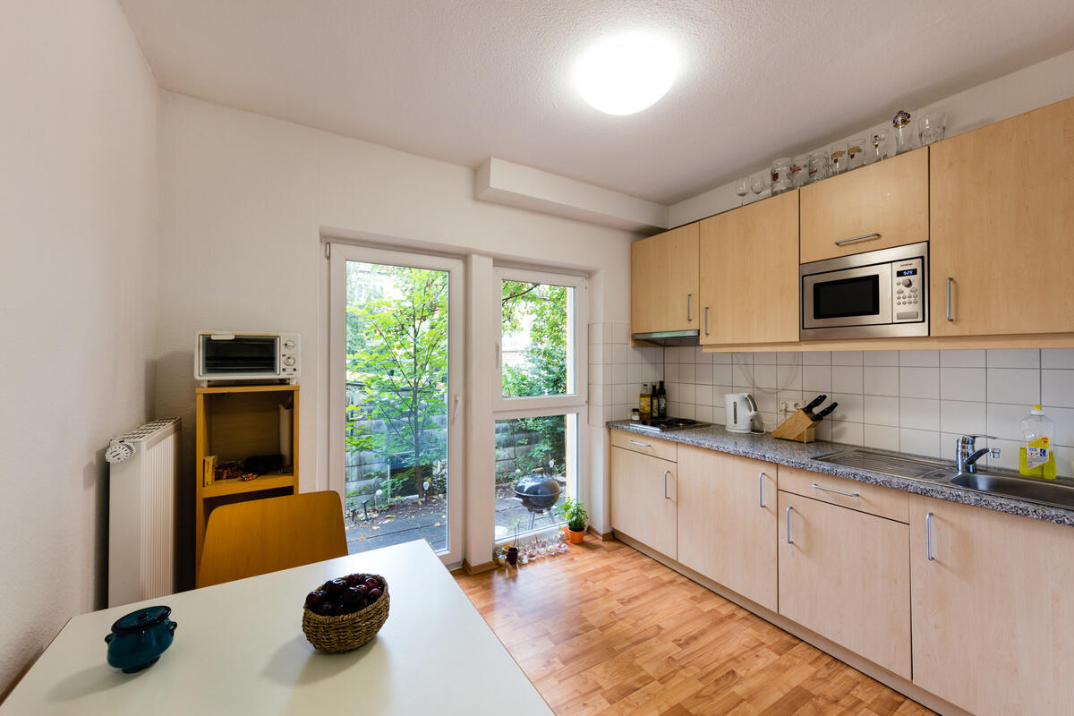 Kitchen with dining table in the dormitory in Alexanderstraße