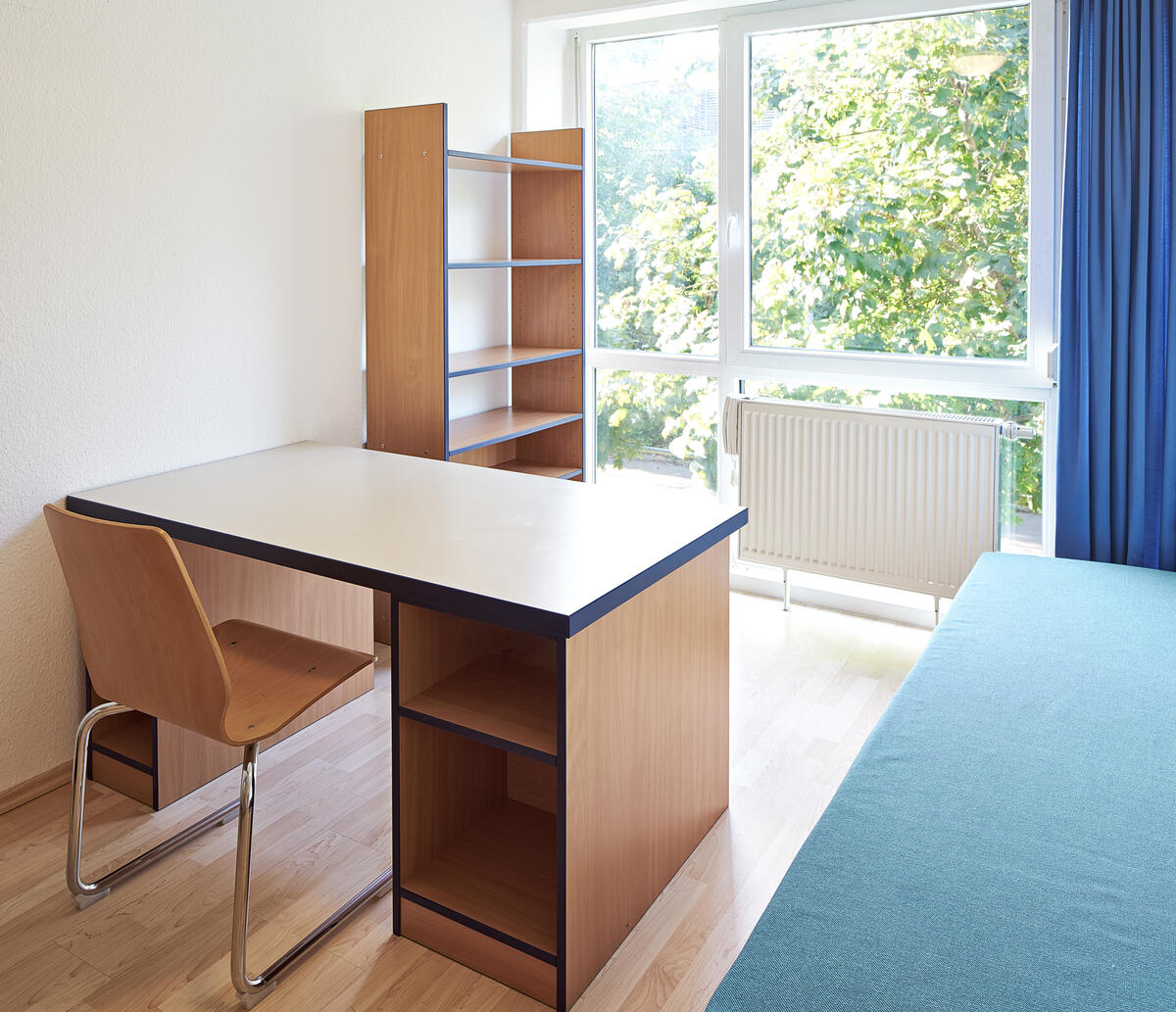 Room with bed and desk in the dormitory in the Au